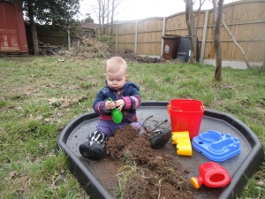 investigating her own little dirt garden while we sort the veg plots